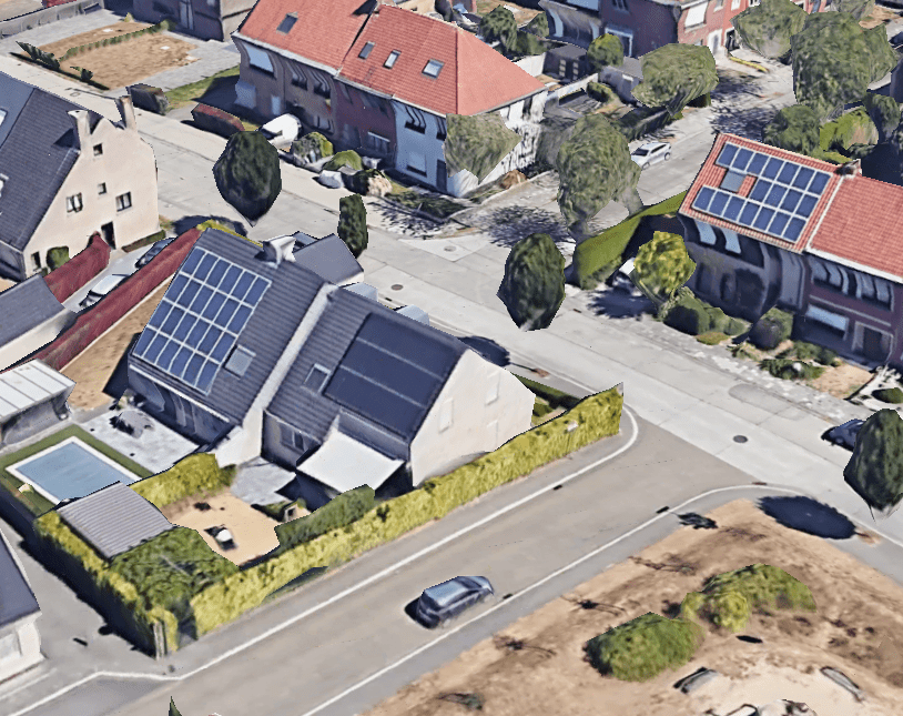 Google earth image van een typische straat in België. De zonnepanelen zie je zo liggen.